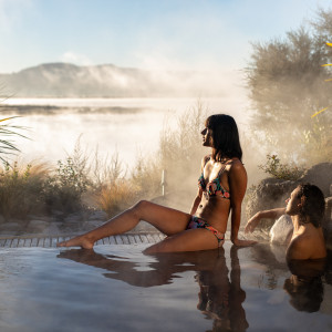 Hot pool soaking right next to Lake Rotorua in the Deluxe Lake Spa