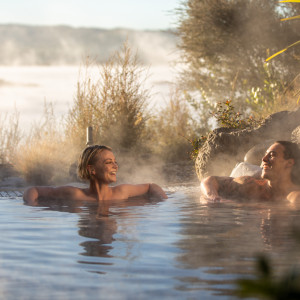 Sit back and enjoy the geothermal Lake Rotorua from hot pools at Polynesian Spa