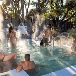 A group enjoying the hot pools at Polynesian Spa