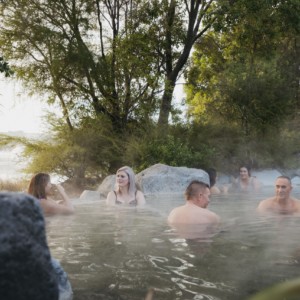 Friends or colleagues enjoying a hot pool soak at Polynesian Spa